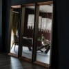 Espejo Excalibur de Cattelan Italia. Espejo con marco en madera y acero.