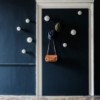 Percha Bottone de Cattelan Italia. Percha de pared con forma de botón.