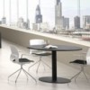 Mesa moderna de juntas redonda diseñada en melanina con base de metal de ofifran