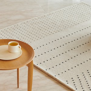 Alfombra de puntos de Fritz Hansen con diseños estilizados y acabados modernos.