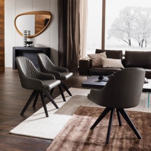 Sillón Olimpia de Ozzio design. Estructura en madera y tapizado en piel, ecopiel o terciopelo.