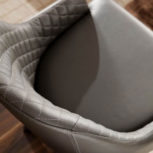 Sillón Olimpia de Ozzio design. Estructura en madera y tapizado en piel, ecopiel o terciopelo.
