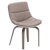 Sillón Selena de Ozzio design. Estructura en madera y tapizado en piel o terciopelo.