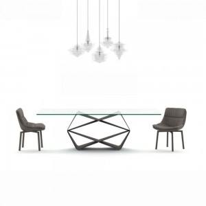 Sillón Siria de Ozzio design. Estructura giratoria tapizada en piel o terciopelo.