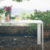 Mesa Four Outdoor de Kartell expresamente diseñada para el aire libre.