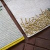 Alfombra diseño Backstitch Calm Green de GAN. Alfombras de lana modernas.