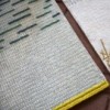 Alfombra original Backstitch Busy Green de GAN. Alfombra de lana de diseño.