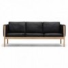 Sofá CH163 piel de Carl Hansen and Son con un diseño único que entrega calidez y modernidad.